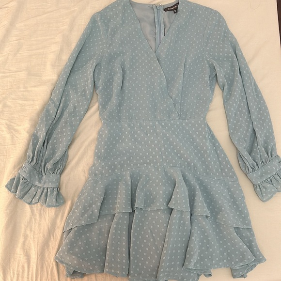 Cute mini dress with a v-neck cross wrap neckline. - Picture 2 of 3
